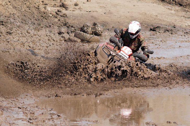 Riding ATV Through Deep Muddy Water