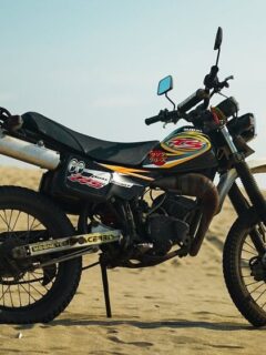 Suzuki TS125 Dual-Sport Motorcycle Parked on Sand in the Desert