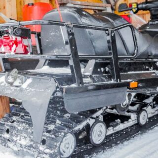 Black Snowmobile Parked in Cabin