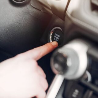 Person Pressing Car Ignition Button